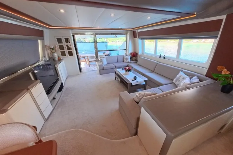  Yacht Photos Pics Luxurious interior of 2005 Princess 25M yacht with elegant seating and large windows.