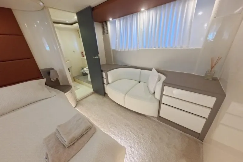  Yacht Photos Pics Luxurious interior of 2005 Princess 25M yacht with elegant bedroom and ensuite bathroom.