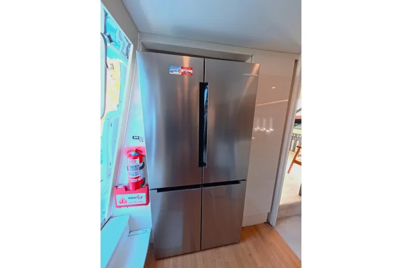  Yacht Photos Pics Stainless steel refrigerator in a modern kitchen on a Princess 25M yacht, 2005 model.