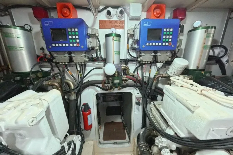  Yacht Photos Pics Engine room of a 2005 Princess 25M yacht with control panels and machinery.