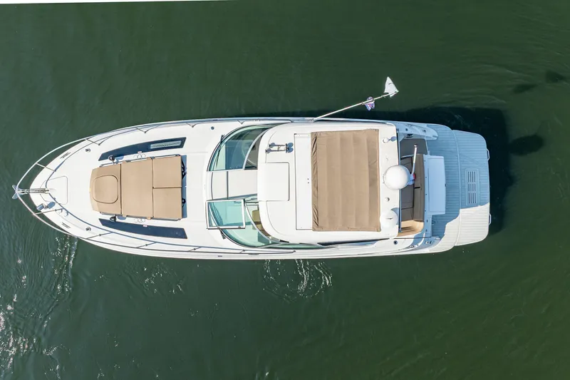  Yacht Photos Pics Aerial view of 2017 Sea Ray Sundancer 350 yacht on calm water.