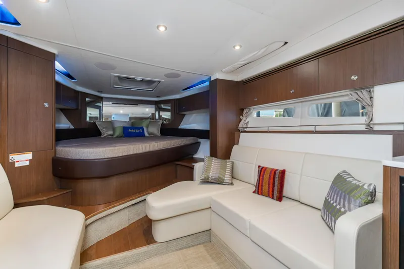  Yacht Photos Pics 2017 Sea Ray Sundancer 350 interior with cozy seating and elegant wood finishes.