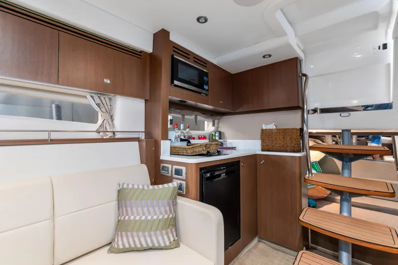  Yacht Photos Pics Interior of 2017 Sea Ray Sundancer 350 yacht with modern kitchen and seating area.