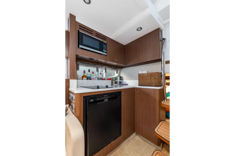  Yacht Photos Pics 2017 Sea Ray Sundancer 350 yacht interior kitchen with microwave and mini fridge.