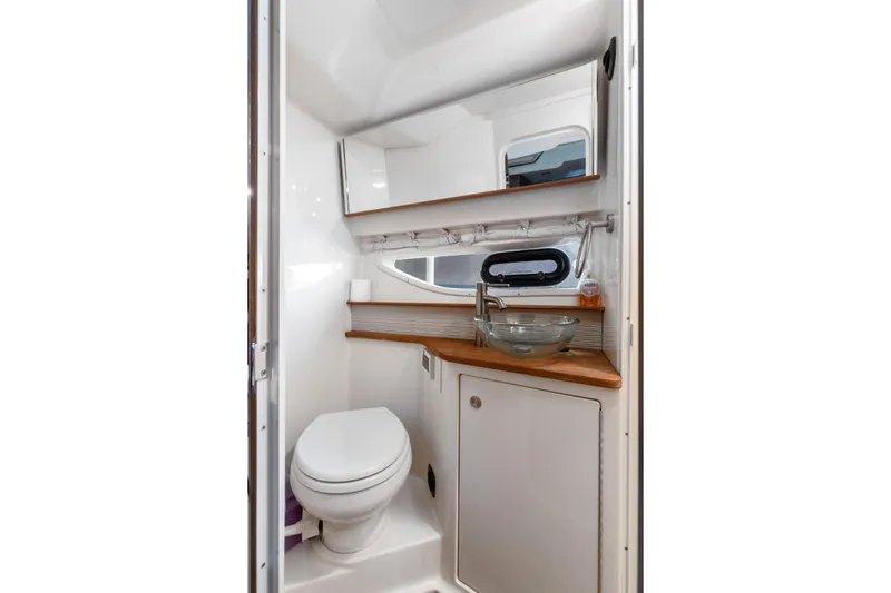  Yacht Photos Pics 2017 Sea Ray Sundancer 350 bathroom with modern fixtures and compact design.