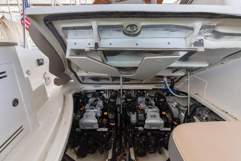  Yacht Photos Pics Engine compartment of 2017 Sea Ray Sundancer 350, showcasing dual engines and mechanical components.