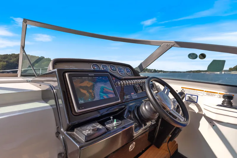  Yacht Photos Pics Cockpit view of 2017 Sea Ray Sundancer 350 with navigation system and steering wheel.