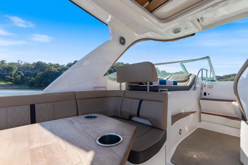 Yacht Photos Pics 2017 Sea Ray Sundancer 350 interior with seating, table, and scenic water view.