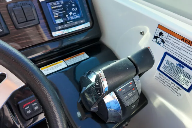  Yacht Photos Pics 2017 Sea Ray Sundancer 350 helm controls with throttle and navigation display.