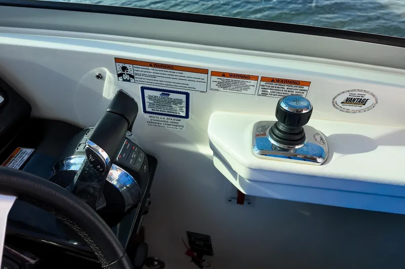  Yacht Photos Pics Control panel of a 2017 Sea Ray Sundancer 350 boat with throttle and joystick.