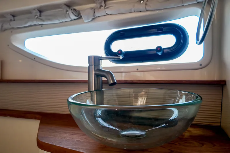  Yacht Photos Pics Glass sink and faucet in 2017 Sea Ray Sundancer 350 yacht bathroom.