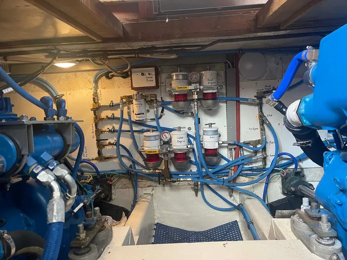 Sea Bird Yacht Photos Pics Engine room of 1985 DeFever 40 Offshore Cruiser with visible fuel lines and filters.