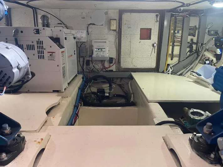 Sea Bird Yacht Photos Pics Engine room of 1985 DeFever 40 Offshore Cruiser with visible machinery and wiring.