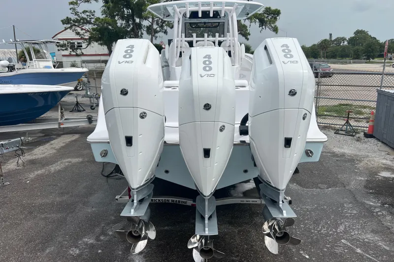  Yacht Photos Pics 2026 Sportsman Open 352 Center Console with triple 400 V10 engines, docked outdoors.