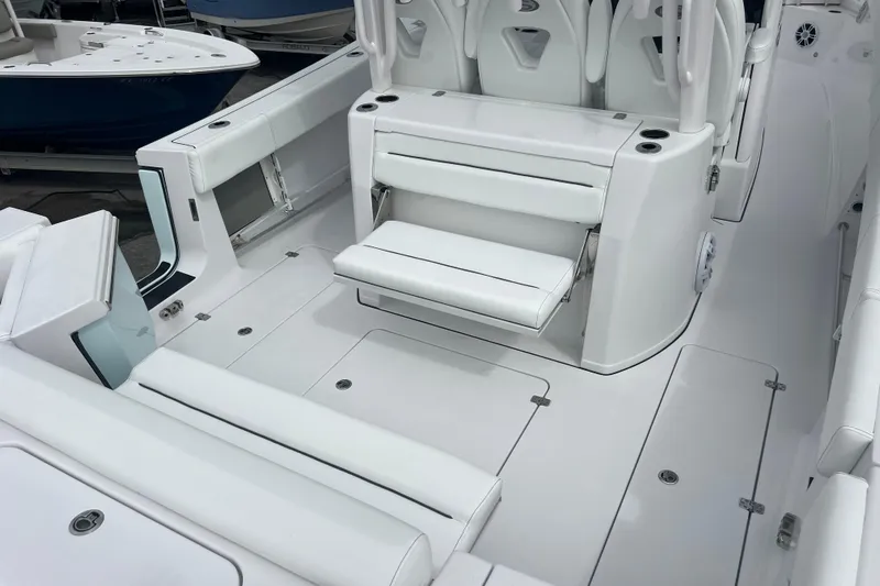  Yacht Photos Pics 2026 Sportsman Open 352 Center Console boat interior with white seating and storage compartments.