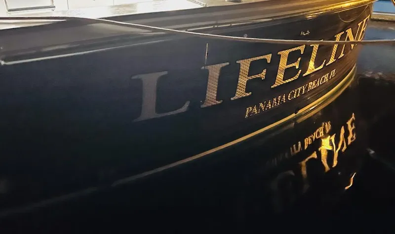  Yacht Photos Pics Hatteras 60 Convertible 2003 yacht with "Lifeline" lettering.