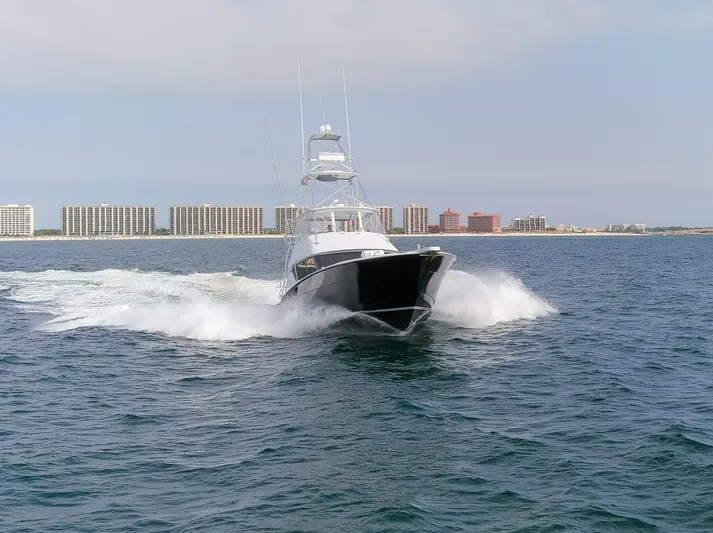  Yacht Photos Pics 2003 Hatteras 60 Convertible yacht cruising on the sea.