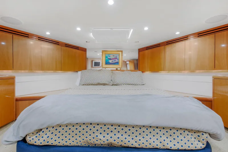  Yacht Photos Pics Luxurious bedroom on a 2003 Hatteras 60 Convertible yacht.