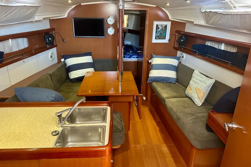  Yacht Photos Pics Interior of 2013 Beneteau Oceanis 37 sailboat with cozy seating and modern amenities.