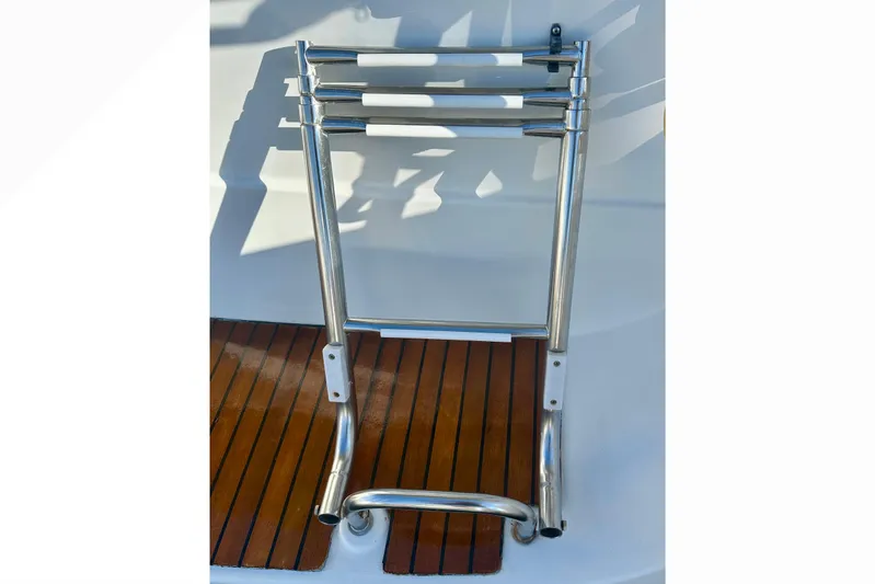  Yacht Photos Pics Stainless steel swim ladder on 2013 Beneteau Oceanis 37 yacht deck.