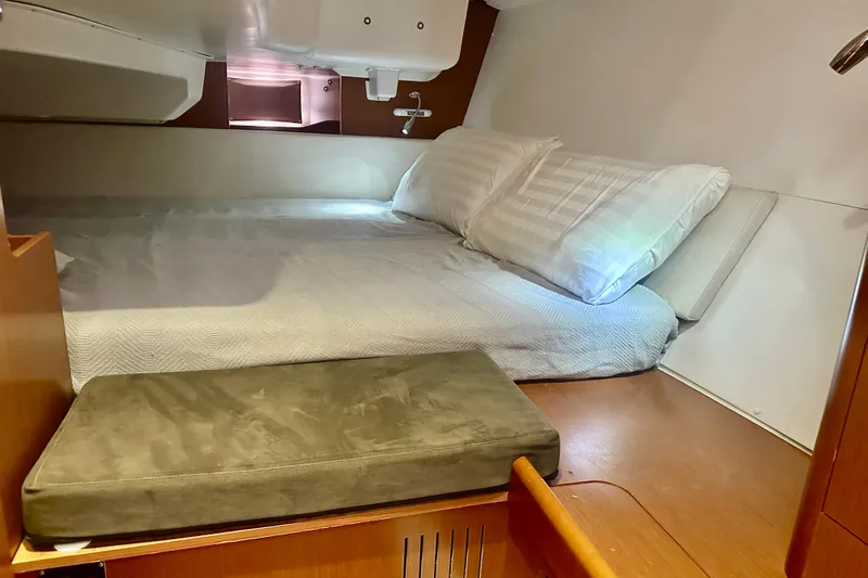  Yacht Photos Pics Cozy cabin interior of 2013 Beneteau Oceanis 37 sailboat with comfortable bedding.