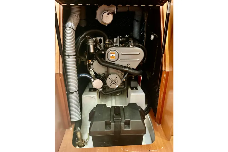  Yacht Photos Pics Engine compartment of a 2013 Beneteau Oceanis 37 sailboat, showcasing mechanical components.