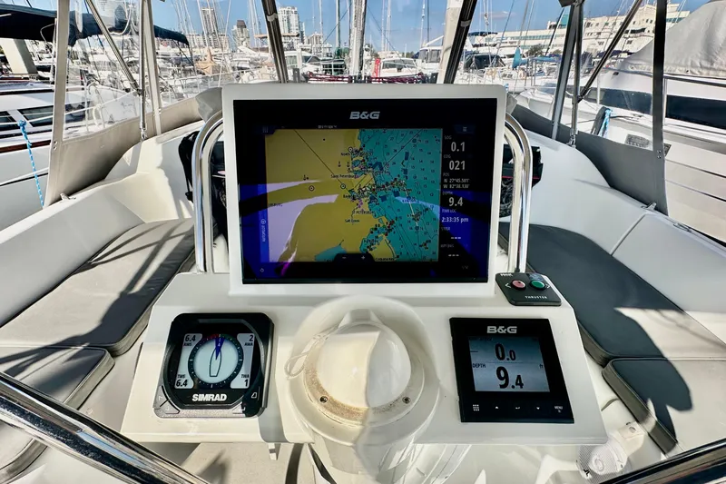  Yacht Photos Pics Cockpit of 2013 Beneteau Oceanis 37 with navigation instruments and chart display.