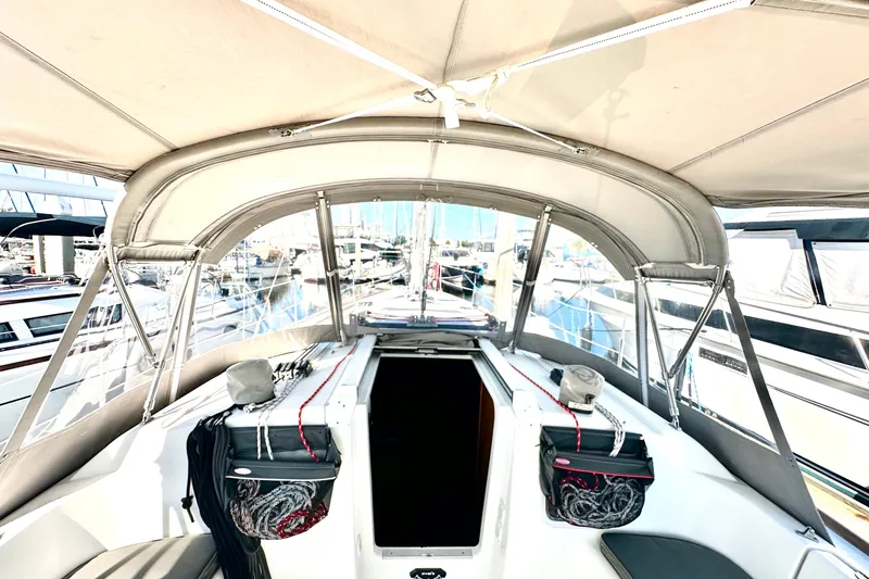  Yacht Photos Pics 2013 Beneteau Oceanis 37 sailboat cockpit with canopy, docked at marina.