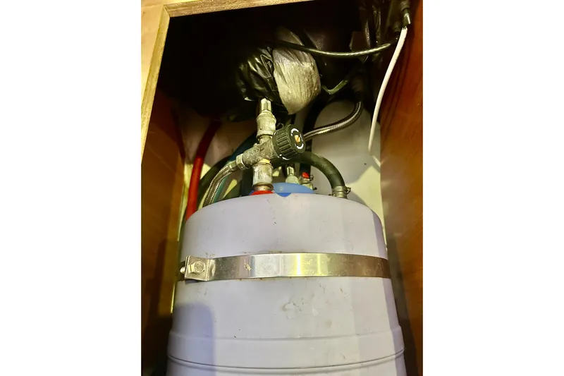  Yacht Photos Pics Water heater system inside 2013 Beneteau Oceanis 37 yacht, featuring pipes and fittings.