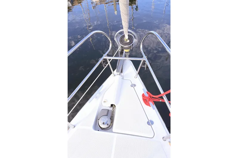  Yacht Photos Pics Bow of 2013 Beneteau Oceanis 37 sailboat with stainless steel railings and red rope.