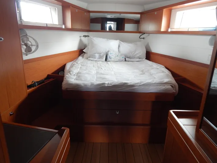 Yacht Photos Pics Luxurious cabin interior of 2015 Beneteau Sense 55 yacht with cozy bedding.