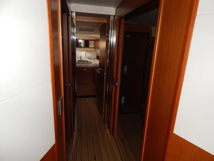  Yacht Photos Pics Interior hallway of 2015 Beneteau Sense 55 yacht with wooden finishes.