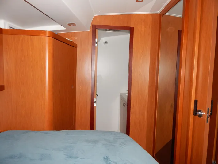  Yacht Photos Pics Interior cabin of 2015 Beneteau Sense 55 yacht with wooden finish.