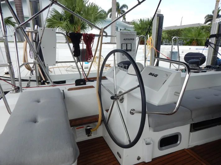  Yacht Photos Pics Interior view of 2015 Beneteau Sense 55 yacht cockpit with steering wheel and seating.