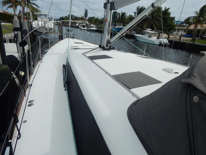  Yacht Photos Pics 2015 Beneteau Sense 55 sailboat docked, showcasing sleek deck design and rigging.