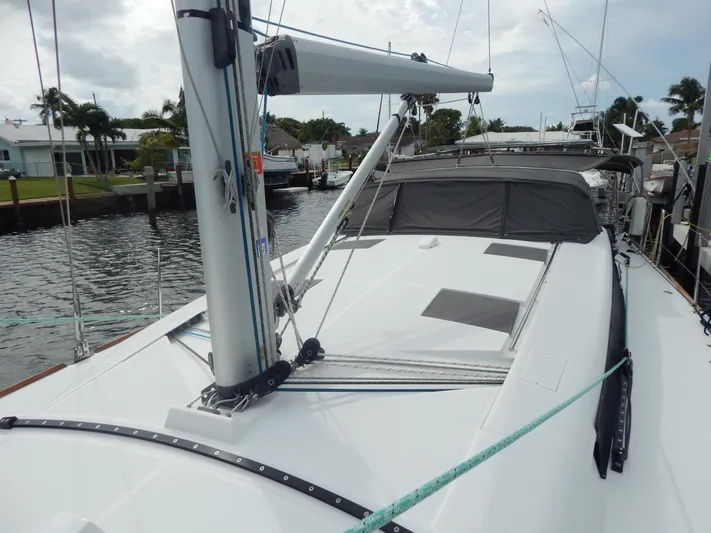  Yacht Photos Pics 2015 Beneteau Sense 55 sailboat docked, showcasing sleek deck design and modern features.