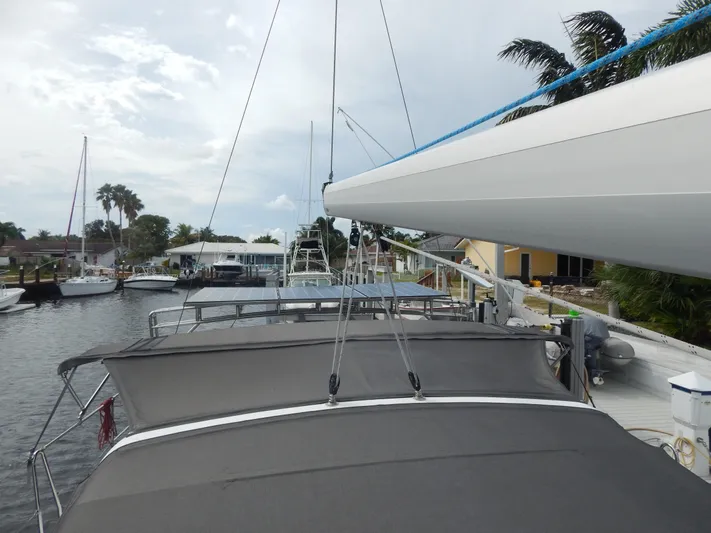  Yacht Photos Pics Beneteau Sense 55 sailboat docked, view of deck and boom, 2015 model.