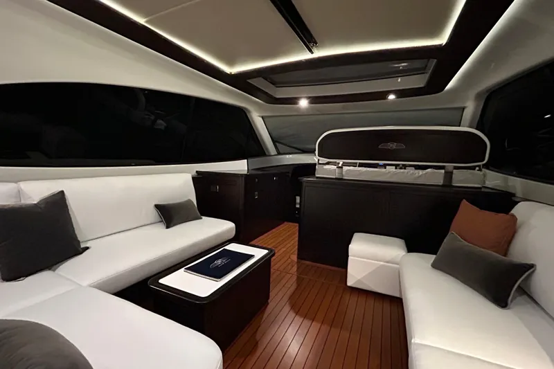 Gt60 Yacht Photos Pics Luxurious interior of 2021 Palm Beach Motor Yachts GT60 with elegant seating and wood flooring.
