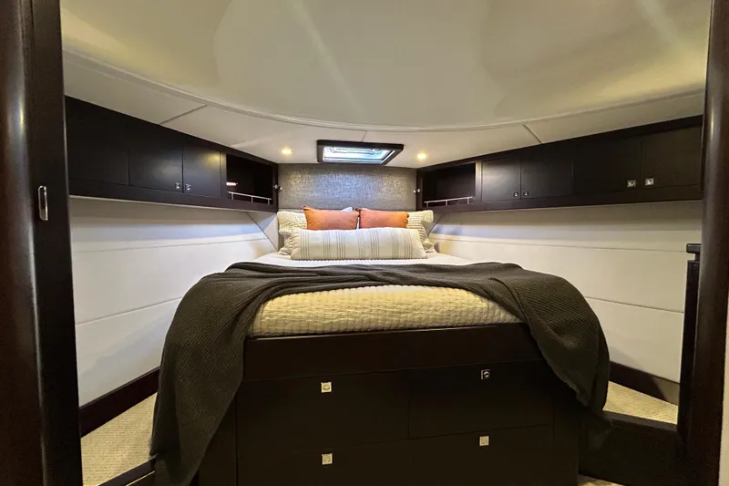Gt60 Yacht Photos Pics Luxurious bedroom interior of 2021 Palm Beach Motor Yachts GT60, featuring elegant bedding and cabinetry.