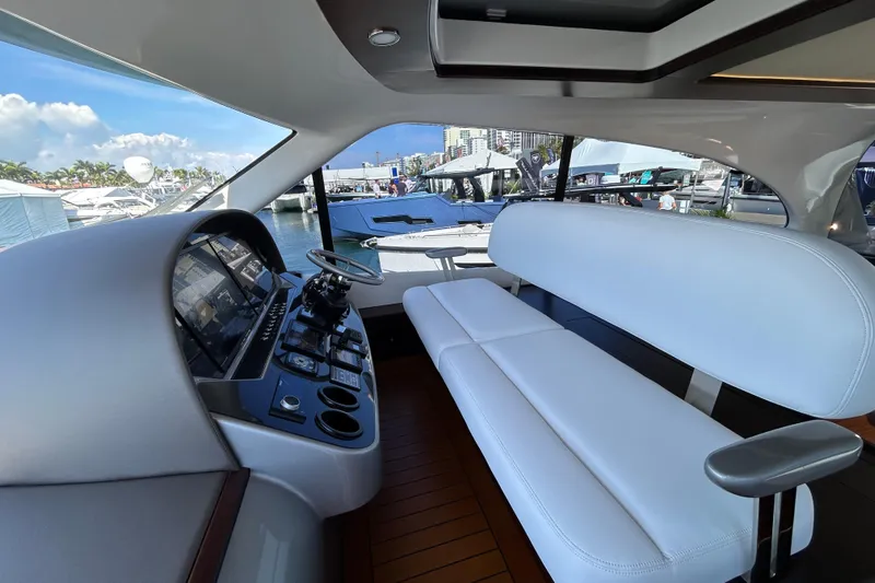 Gt60 Yacht Photos Pics 2021 Palm Beach Motor Yachts GT60 interior with sleek helm and white seating.