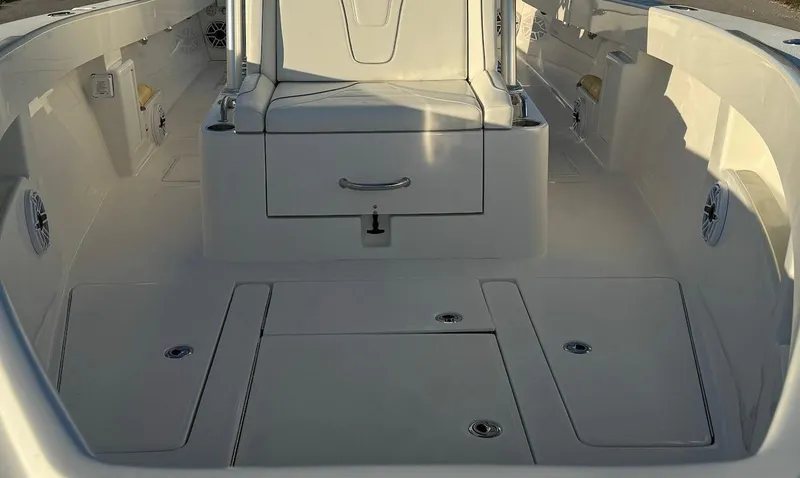  Yacht Photos Pics 2023 SeaVee 290B boat interior, featuring spacious deck and storage compartments.