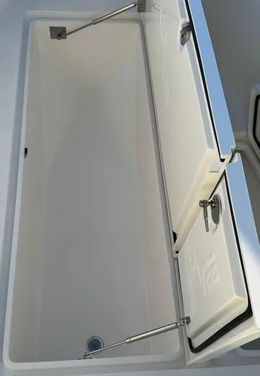  Yacht Photos Pics 2023 SeaVee 290B boat storage compartment with open lid and stainless steel hinges.