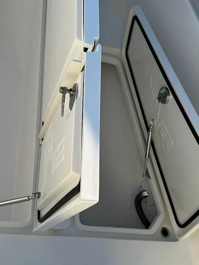  Yacht Photos Pics 2023 SeaVee 290B storage compartment with open hatches and hydraulic supports.