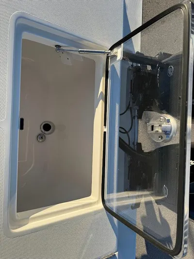  Yacht Photos Pics 2023 SeaVee 290B boat storage compartment with open lid.