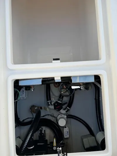  Yacht Photos Pics 2023 SeaVee 290B boat compartment with visible wiring and components.