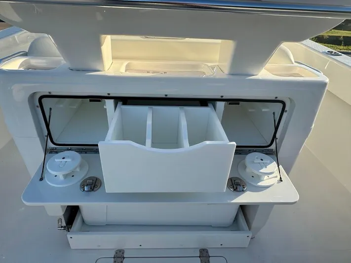  Yacht Photos Pics 2023 SeaVee 290B boat with open storage compartments and fishing gear holders.