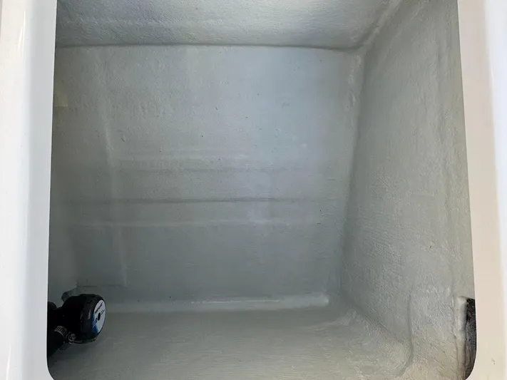  Yacht Photos Pics 2023 SeaVee 290B storage compartment interior, featuring a clean, spacious design.