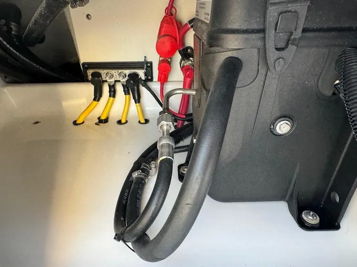  Yacht Photos Pics Engine compartment of 2023 SeaVee 290B boat, showing cables and hoses.