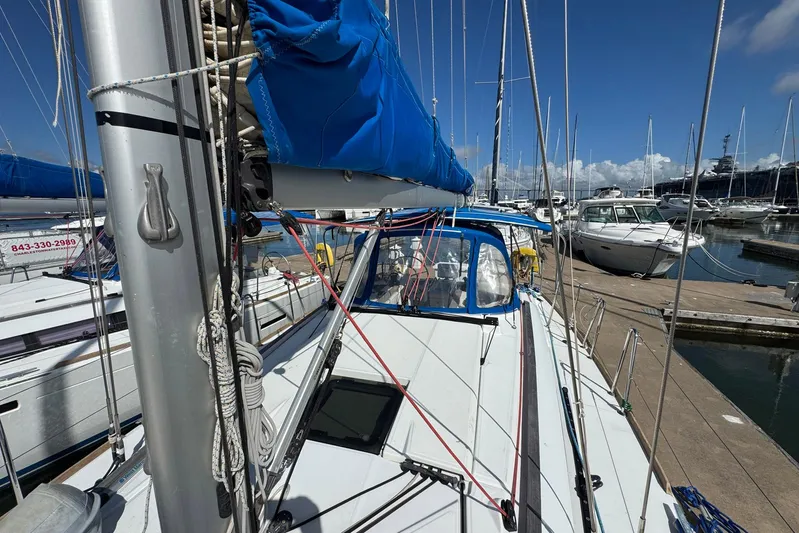 Sea Ranch II Yacht Photos Pics 2018 Jeanneau Sun Odyssey 389 sailboat docked at marina under clear blue sky.