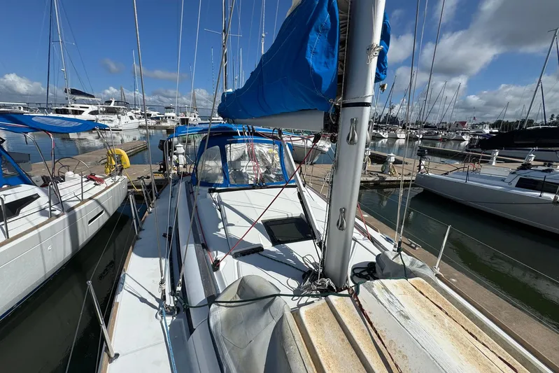 Sea Ranch II Yacht Photos Pics 2018 Jeanneau Sun Odyssey 389 sailboat docked at a marina under a clear blue sky.